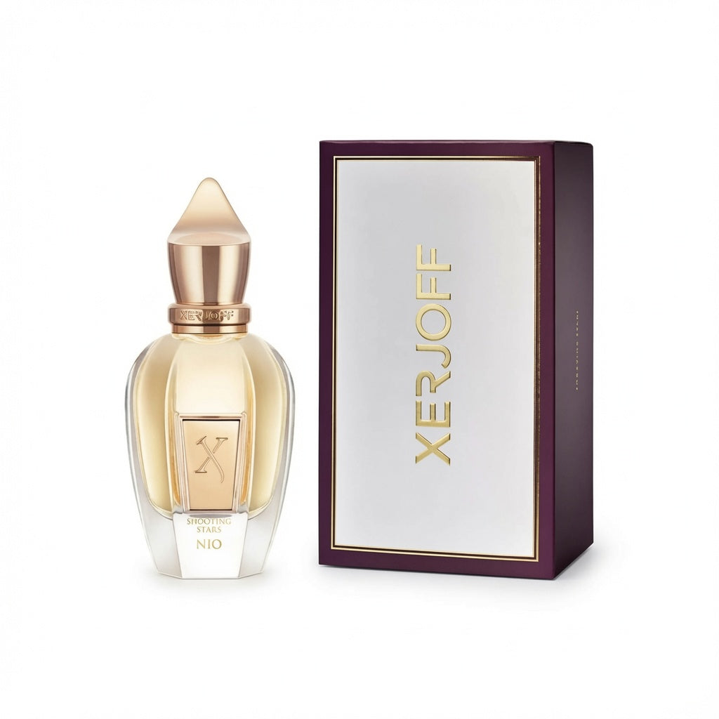 Xerjoff perfume bottle with a gold cap and pale amber liquid, shown next to its dark purple and white box with gold lettering.